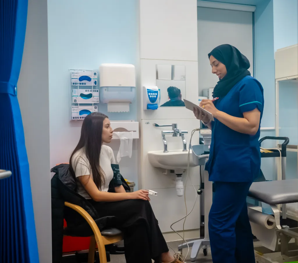 Faatima speaking to a patient